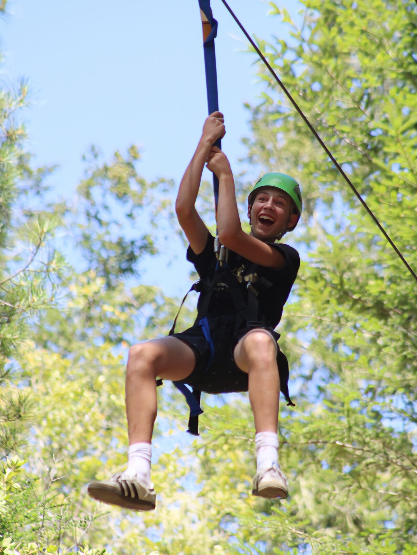 young man on zip line
