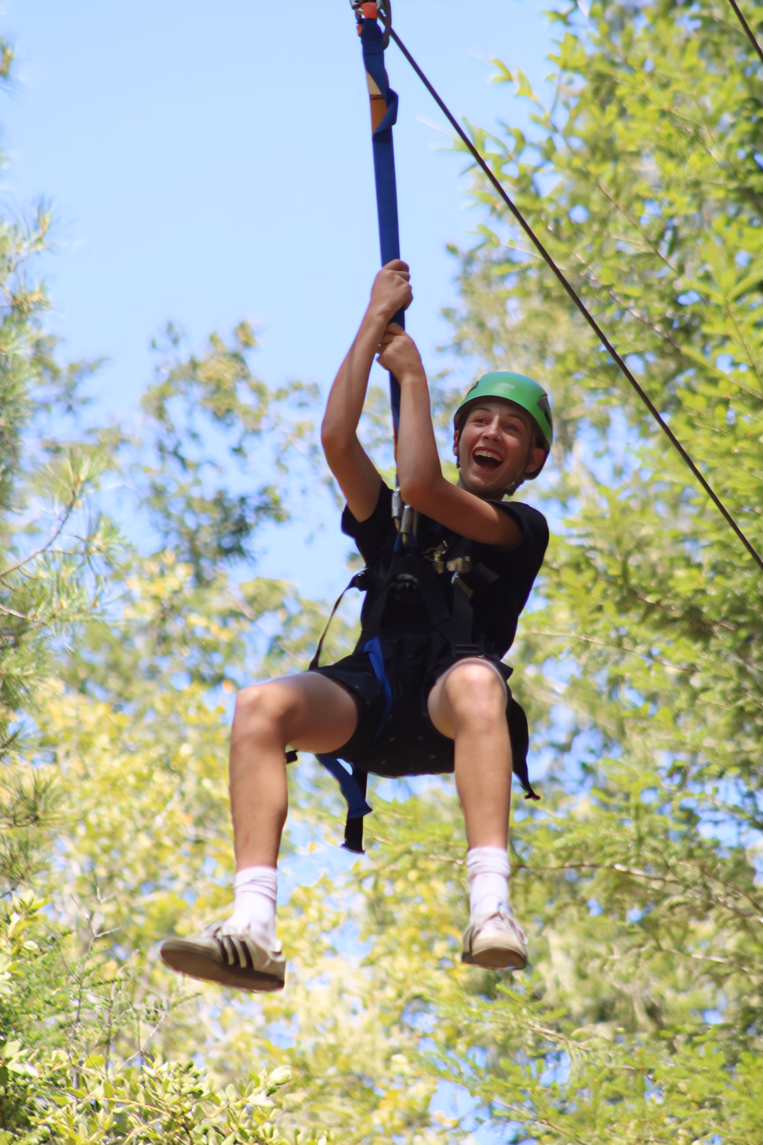 young man on zip line