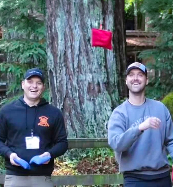 home-mens-retreat 2 adult men playing cornhole